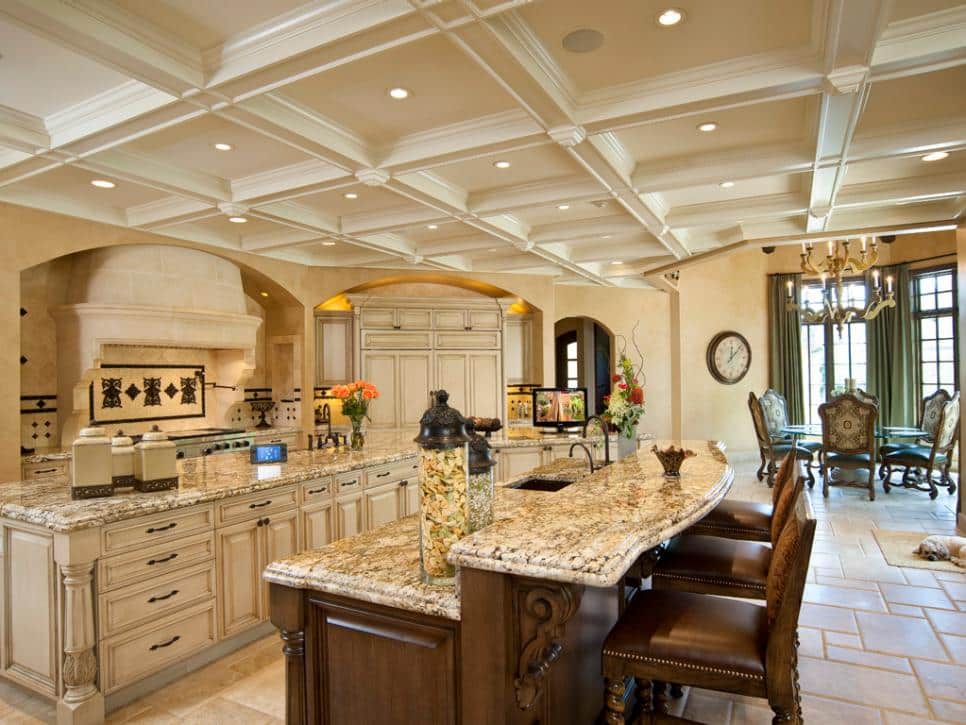 Kitchen with Ceiling Rafters and a Raised Block of Wall