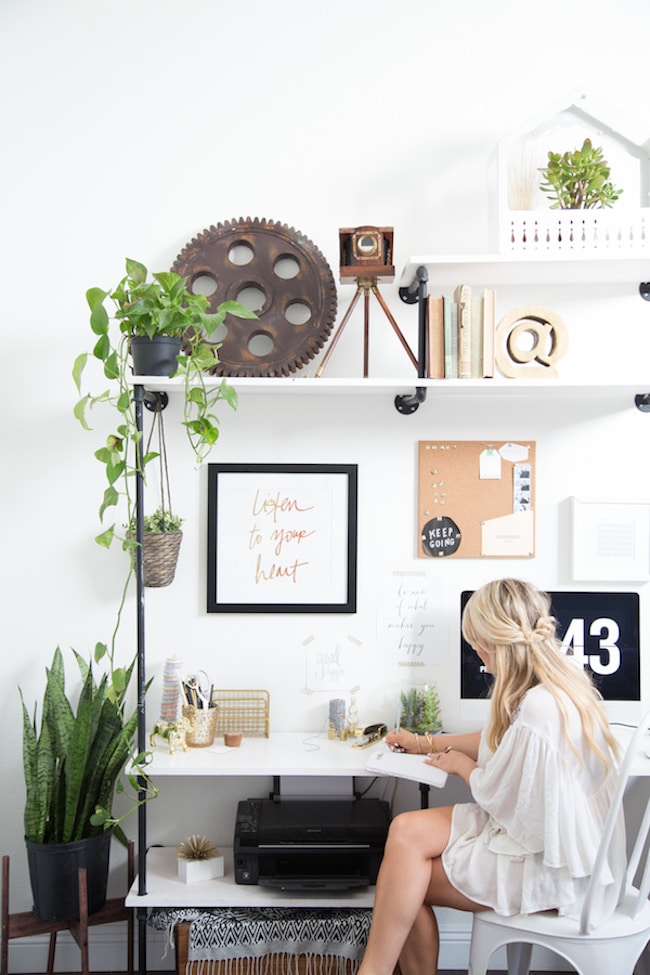 Bright home office with touches of green plants