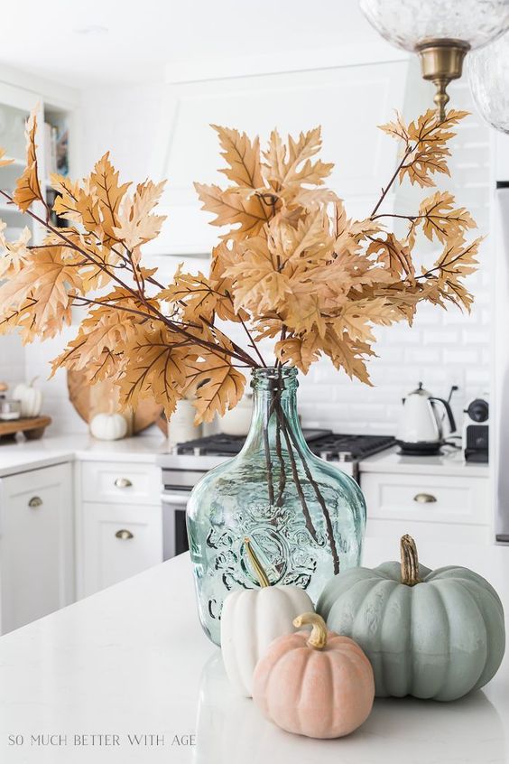 Fall flowers with pumpkins