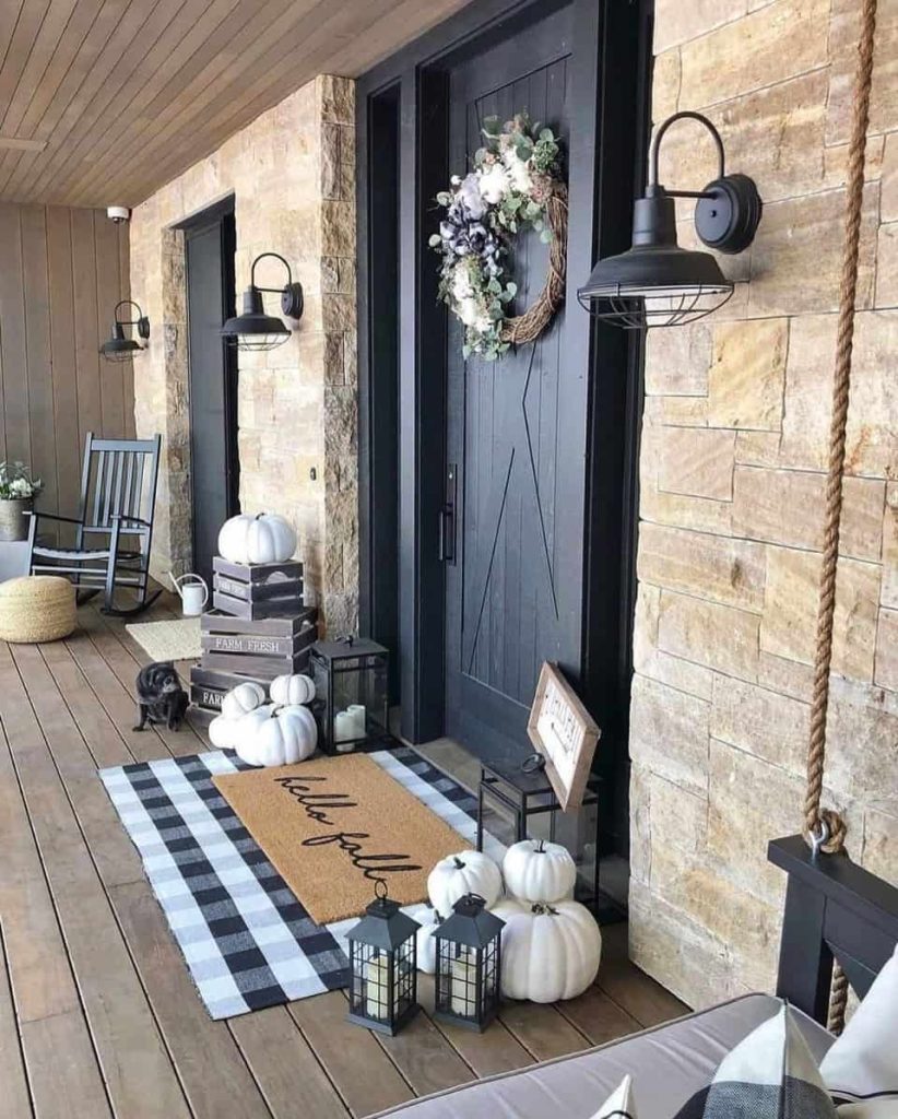 front door black and decorating the front porch