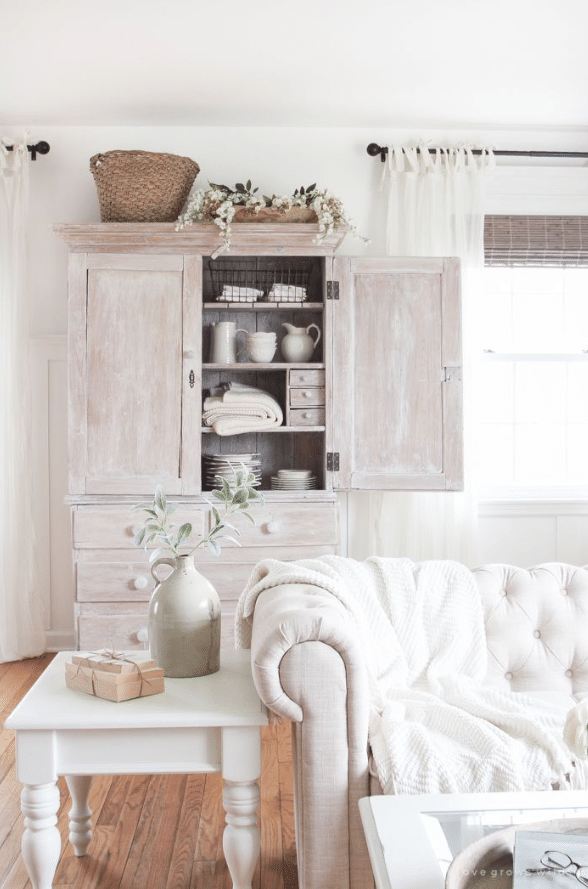 tufted sofa and a country white end table