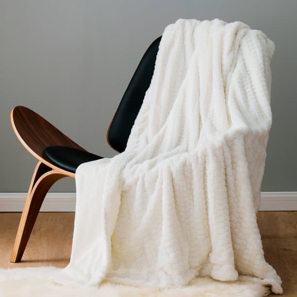 Use Throws to Soften Up Sleek Furniture