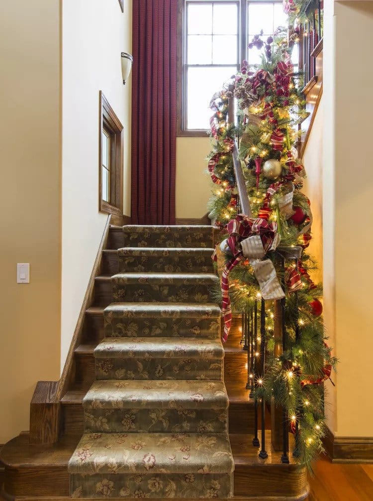 adorn your staircase with faux garlands 