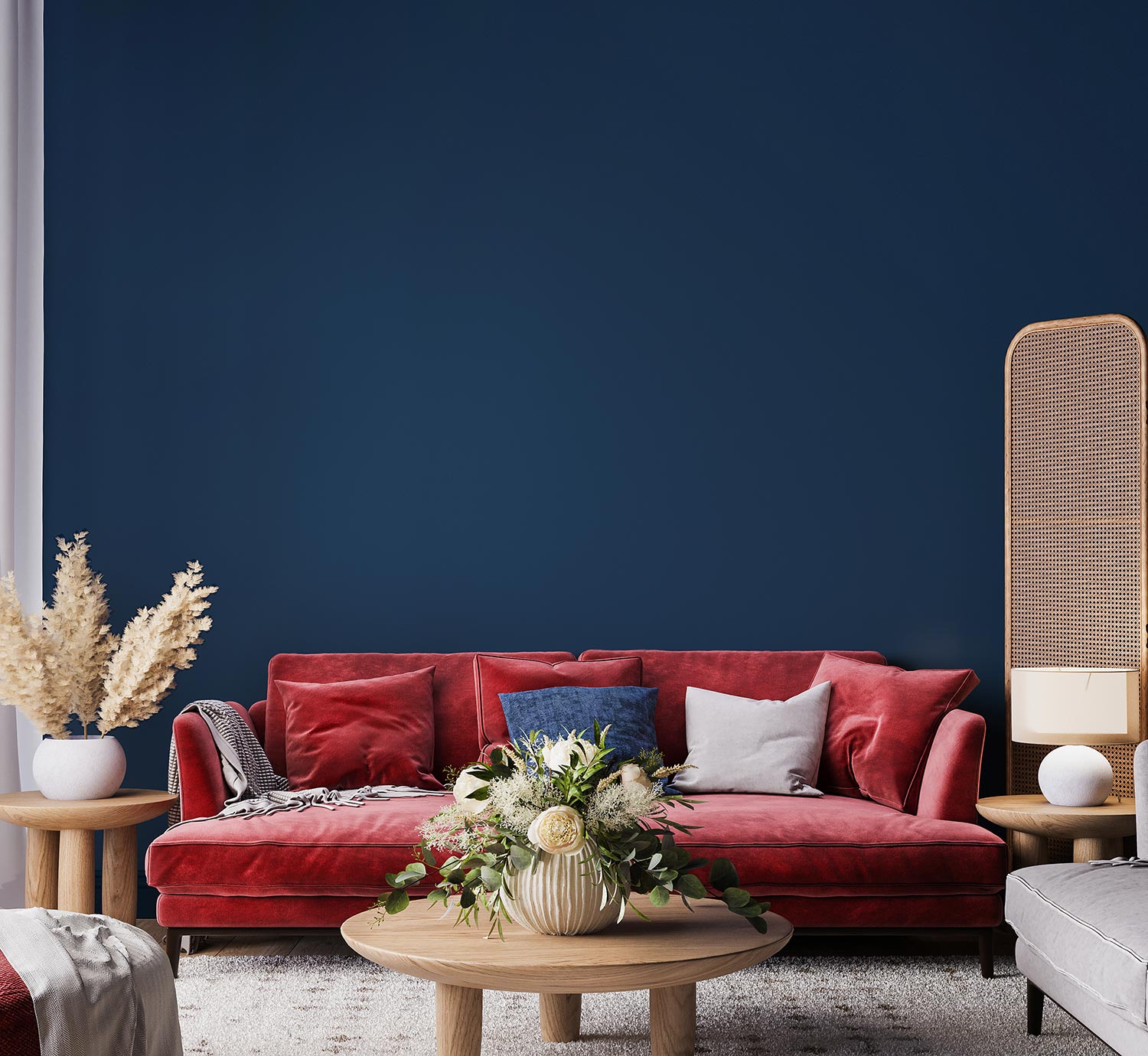 Living room interior mock-up with red sofa, wooden table and rattan home decoration in dark blue background, 3d render, 3d illustration