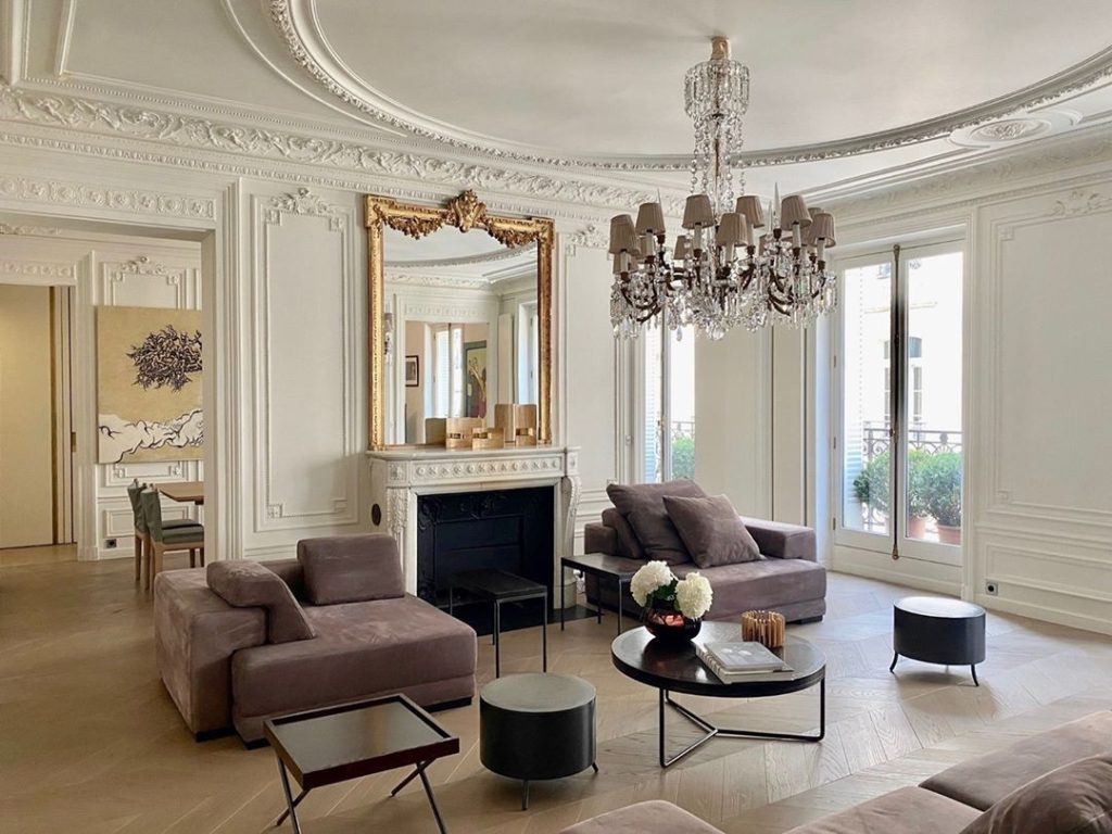 Gold Mirror Over The Marble Fireplace