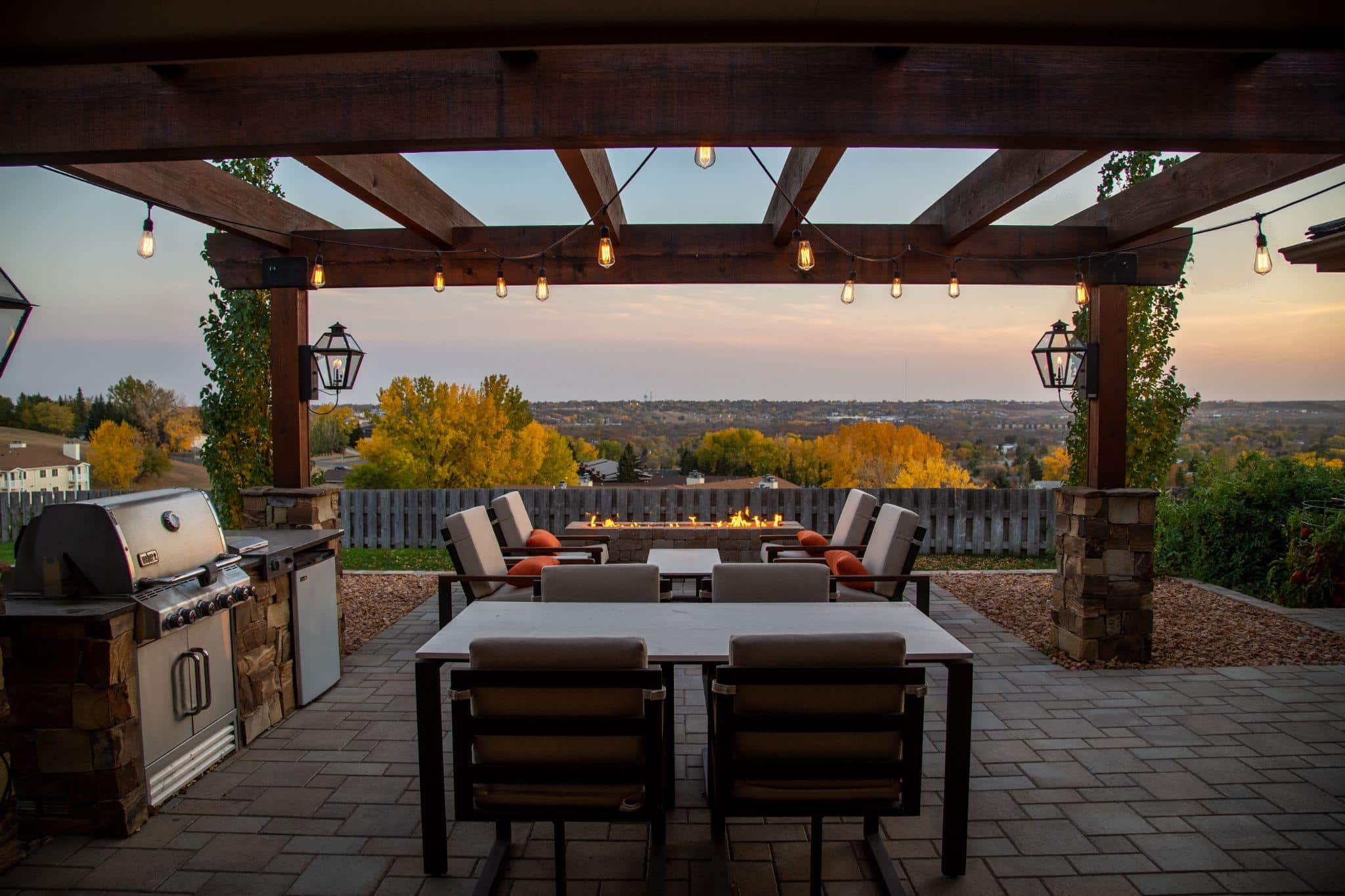 Patio with a kitchen and grill. 