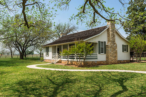 A quaint white ranch-style house nestled in a serene setting