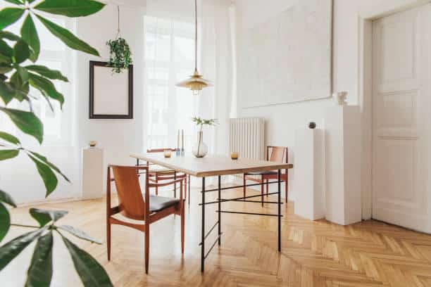 Stylish and modern dining room interior with design furniture. Eclectic decor.