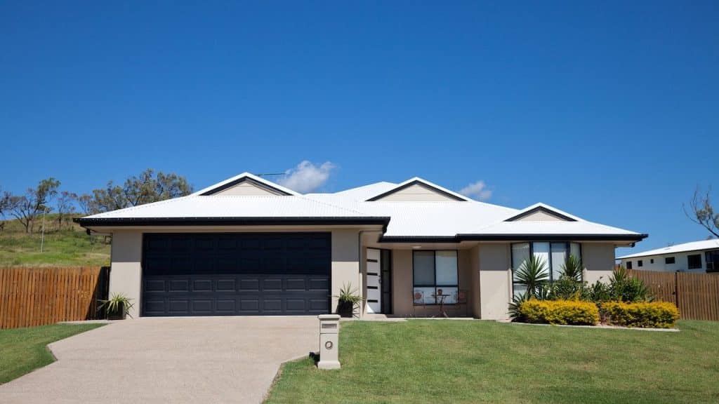 A ranch-style home with a garage and driveway.