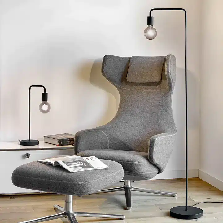  Scandinavian floor lamp illuminating a modern living room with its sleek design and warm glow.