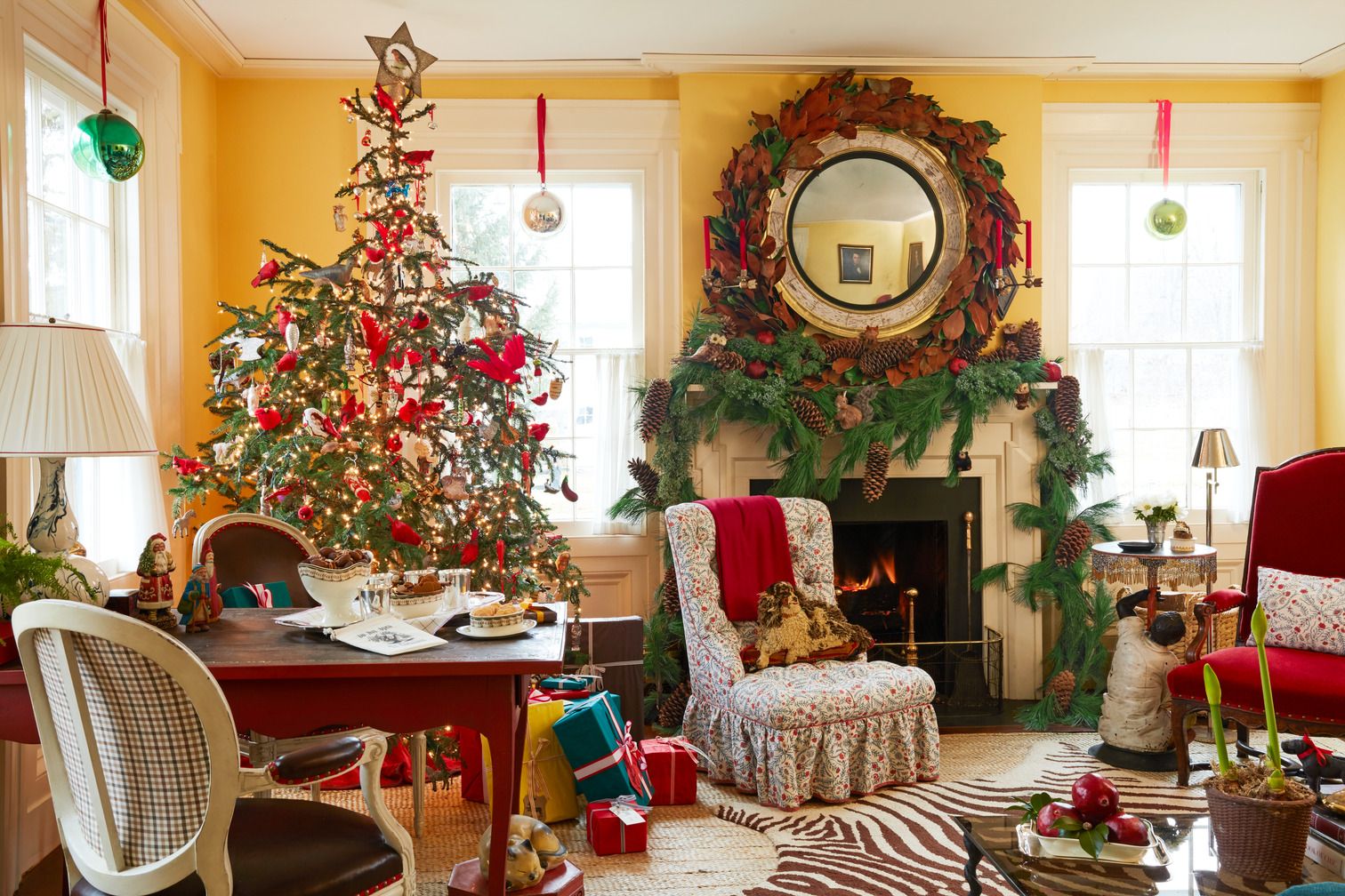 A red chair in the corner, adding a pop of color to the room