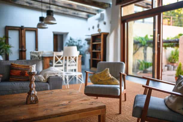 Nice living room in a house in Spain. Green backyard is in the back.