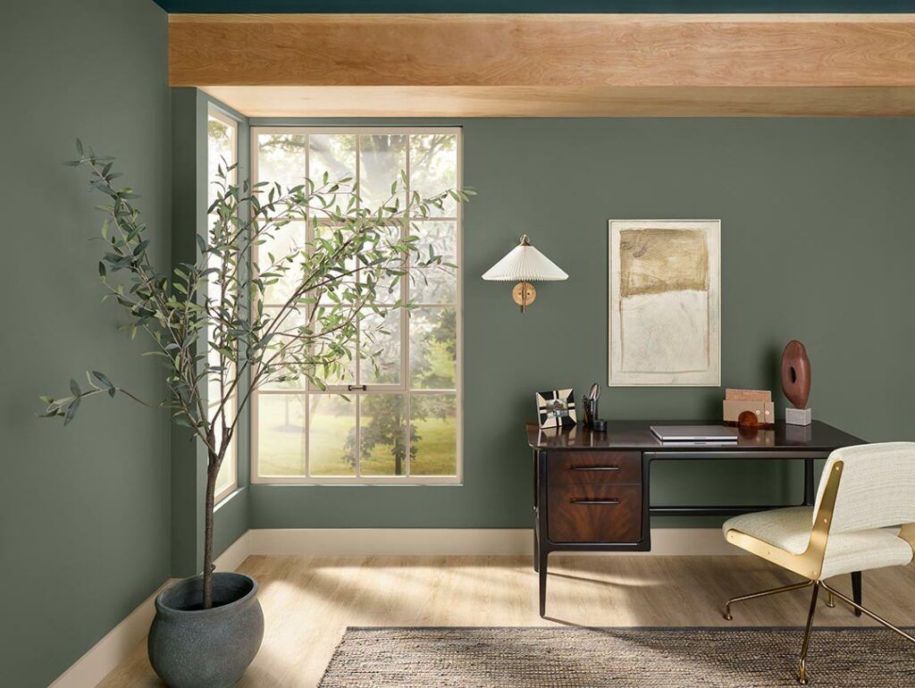  A cozy home office with a desk and window, providing a serene workspace.