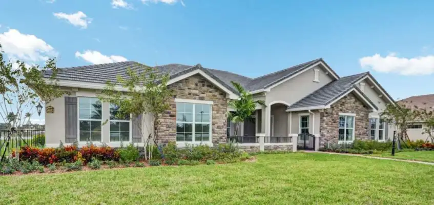 Exterior view of an ideal ranch house with a spacious layout, low roofline, and large windows