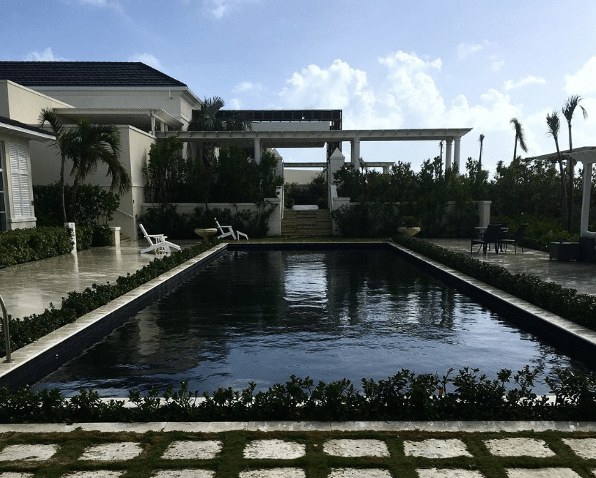 What is your understanding of a black bottom pool? This is a swimming pool wherein the bottom portion is coated with black layers. Vinyl, plaster of Paris, and fiberglass are coating materials added to design black bottom pools. Black pools lend aesthetic vibes to commercial properties like hotels, staying inns, and homestay locations. The perfect nightlife effects are brought to life with these designer pools. Black pools radiate natural sunlight during the daytime. They absorb the maximum amount of heat from the sun. As a result of this, the pools retain water that has warmer temperatures. This means the water remains warmer even during midnight hours. Therefore, hotels or commercial hubs construct black water pools to save their energy bills too. In this online guide, you will also learn other interesting aspects of how darker shade pools thrive. Black Bottom Pools Are The Gothiest Way To Float Your Summer ... 1. How Do Black Pools Increase the Temperature of Water? Darker colors absorb sunlight, while lighter shades reflect light. Therefore, when you have a black swimming pool, it absorbs the maximum amount of sunlight during the day. The water inside the pool, therefore, remains warmer even post-twilight hours. Therefore, this is a major attraction for youngsters and teen adults who may want to swim even at midnight. Hotels, resorts, and homestays prefer black swimming pools to save up their energy bills during winter months. As the water naturally retains its warmth, the hotels needn’t use heaters to warm the water up. 2. Differences Between the Water Color and Mosaic Tile Design There are noticeable differences between swimming pools' water and the tile design. When real-estate developers construct dark-shaded pools, the mosaic design takes shades like black, gray, brown, and bottle green. The waters absorb sunlight that keeps their waters warmer. On the other hand, some of the posh hotels in South Africa, Thailand, and South Africa add elements to water so that its tint improves. However, even though the water changes, it remains cool and crystal clear for tourists and vacationers to enjoy their swimming experiences at these locations. For instance, the greenish-blue tinge at beach pools in the Maldives, the red pools in Thailand, and the navy blue waters in South Africa, famous pool developers improve the water tint above anything else. 3. Pool Chemistry Also Plays a Major Role Well, pool chemistry is the connection between the color of waters and temperature that impacts ecosystems that thrive in the same. Concerning black water pools, the dark ambiance prevents algae from growing. The algae, sea-fishes, and other aquatic ecosystems thrive at light-shaded pools as they can hunt for their food, water, and air. Similarly, aquatic ecosystems enhance the nutrient density of waters with rich nitrates, fresh oxygen, and so on. On the other hand, in black pools, you cannot see algae growth. You also cannot detect wild animals or other species like frogs, tadpoles, or crocodiles that may enter dark waters while you may want to swim for an hour. 4. Safety Concerns As against lighter hue pools, darker pools raise safety concerns. This is mainly because elders or Senior citizens cannot gauge the water depth. Similarly, adults who have younger children also fall at risk of taking their kids for pleasurable hours of swimming. This is because, inside black waters, it is difficult to identify the initial markings and the end markings. In other words, it is difficult to identify where the swimming pool begins and ends. As a result of the same, elders getting hurt at uneven ridges of the darker pools is more common. Senior citizens who have Alzheimer’s disease, Diabetes, or even Color blindness can drown in darker waters. Safety concerns are primarily the main reason black bottom pools are banned across most regions of the US, such as Texas, Mexico, New York, California, etc. 5. The Black Bottom Coating Easily Gives Way As the black bottom is made from vinyl, plaster of Paris, or concrete forms of fiberglass, you never know when and how the black coating gives way. Of course, the black bottom area of the pool can get eroded due to constant wear and tear. Teen adults and even experienced swimmers can get hurt when their feet touch the uneven ridges of the swimming pool. Therefore, owners of hotels, motels, inns, and room stays must constantly repair or renew the black bottoms occasionally. It can be a tedious affair. And the cost of maintenance also goes up because these pools require comprehensive care. 6. Why Are Lighter Pools Preferred? Swimming pools with lighter shades of blue and white lend a serene ambiance to swimming. As lighter hues reflect the maximum amount of sunlight, the visibility of the waters is never a problem. The tiles made of blue and white have their markings as to how you get into the water how you can dive deeper and where you rest. Adults and elder citizens, therefore, feel safer to swim inside lighter pools. When you have a pool bottom made from pastel blue, the waters promote the growth of mushrooms or algae, which can further improve the pool's chemistry, making it oxygen-rich. Conclusion Ultimately, black-bottom swimming pools have brilliant aesthetic value in appearance. However, due to safety concerns, many hotel owners think twice about constructing black swimming pools. Hotels or Homestays in South Africa or Europe prefer brown or teal green bottoms for their pools as darker hues radiate heat from the sun and keep waters warmer over a longer duration of time. In Thailand, red waters inside pools are due to improving water tint. Red mosaic tiles are added to the sides of the swimming pools. As a global trotter, how do you want your swimming pool to be? Do let us know in the comments!