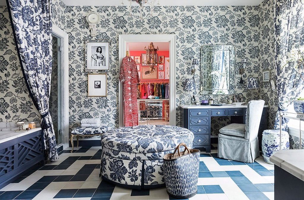 Blue and white patterned wallpaper in a bathroom.