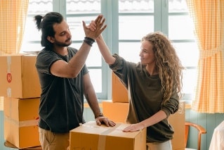 Couple high-fiving after successfully moving from Florida to Arizona