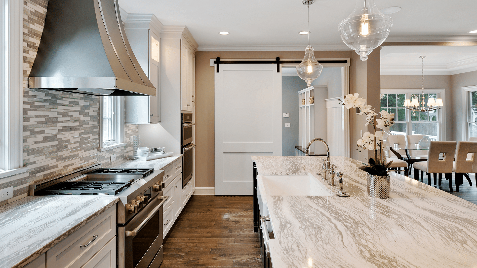 A kitchen island is in the center of the kitchen area and easy to reach from all sides